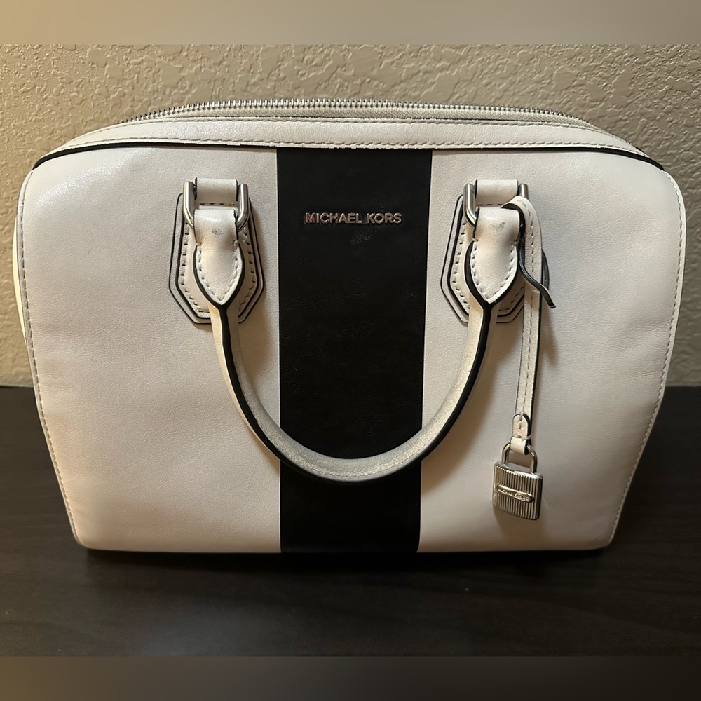 Used Michael Kors black and white purse.